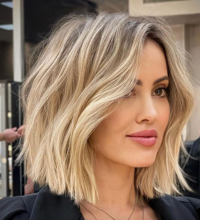 Long lob haircut styled with soft beach waves