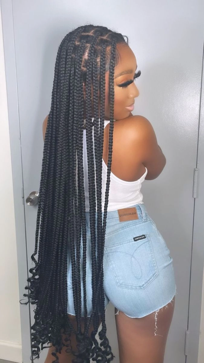 Extra long beach braids cascading down the back with wavy texture and seaside shine