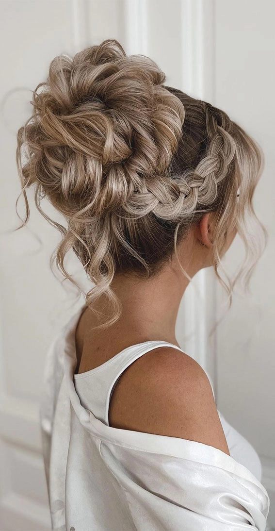 Long beach hair updo with soft waves and braided details for a breezy beach style