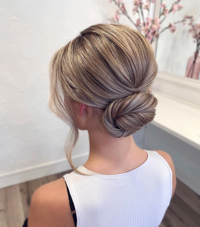 Elegant long beach hair updo with soft waves and braided accents