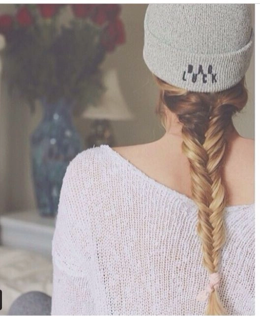 Sun-bleached ombré beach braid cascading over bare shoulders with soft waves and sea salt texture