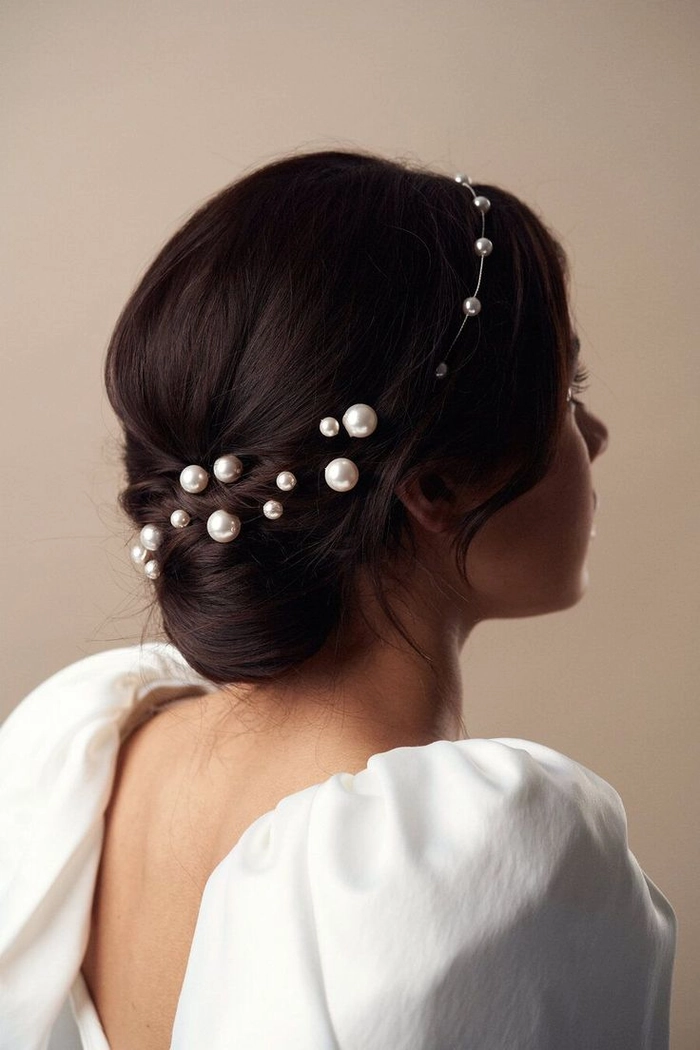 Pearl hair pins adorning a chic beach updo