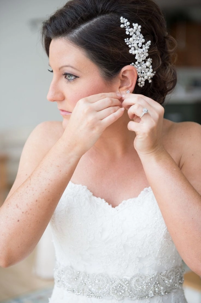 Beach updo secured with pearl hair pins for a romantic seaside look