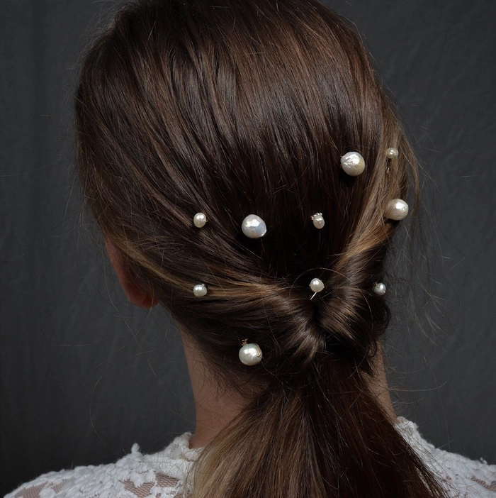Pearl hair pins elegantly placed in a beach updo hairstyle