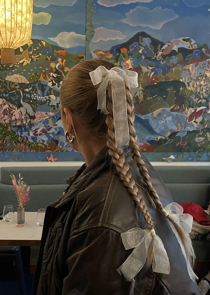Ribbon tied beach braids with soft waves and a boho vibe