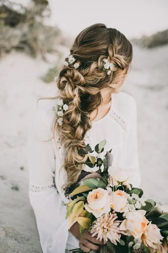 Romantic beach waves adorned with delicate white flowers