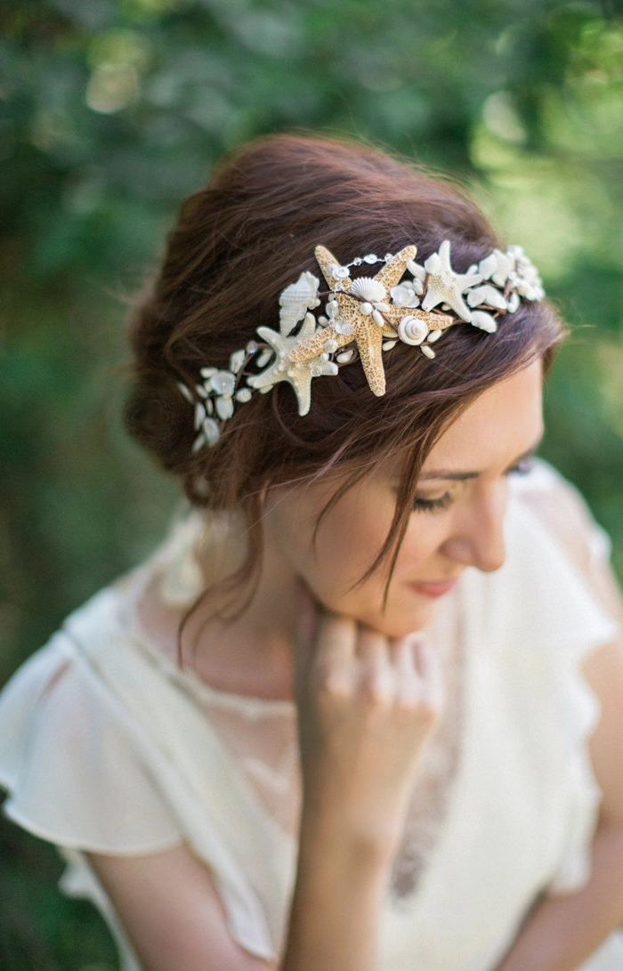 Bride with seashell hair accessories at a beach wedding ceremony