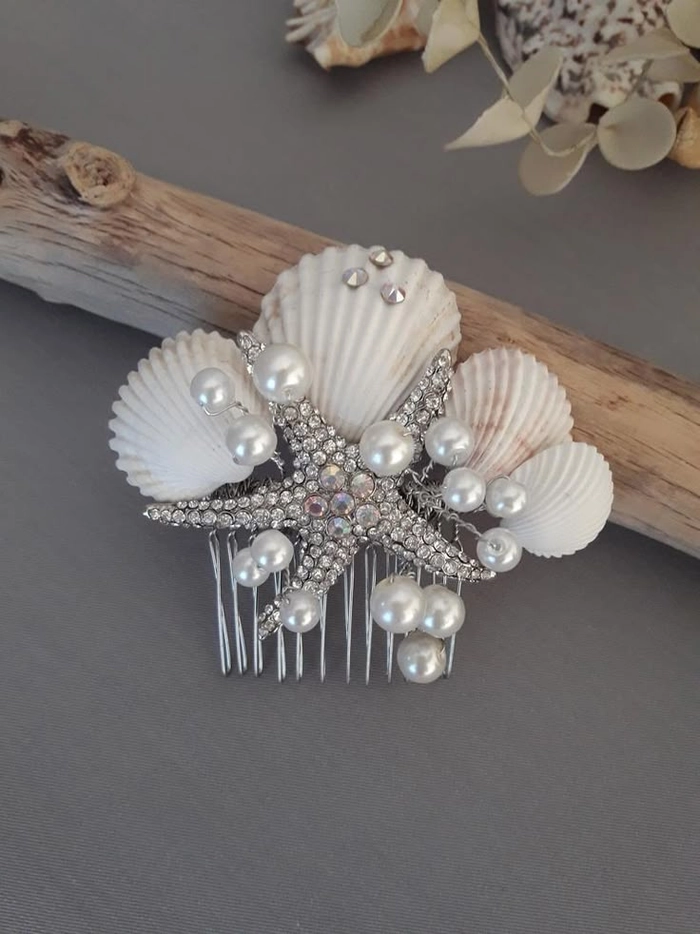 Bride adorned with seashell hair accessories in a beach wedding updo