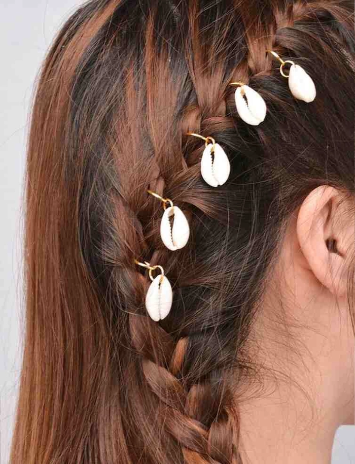 Beach wedding hairstyle adorned with delicate seashell hairpins