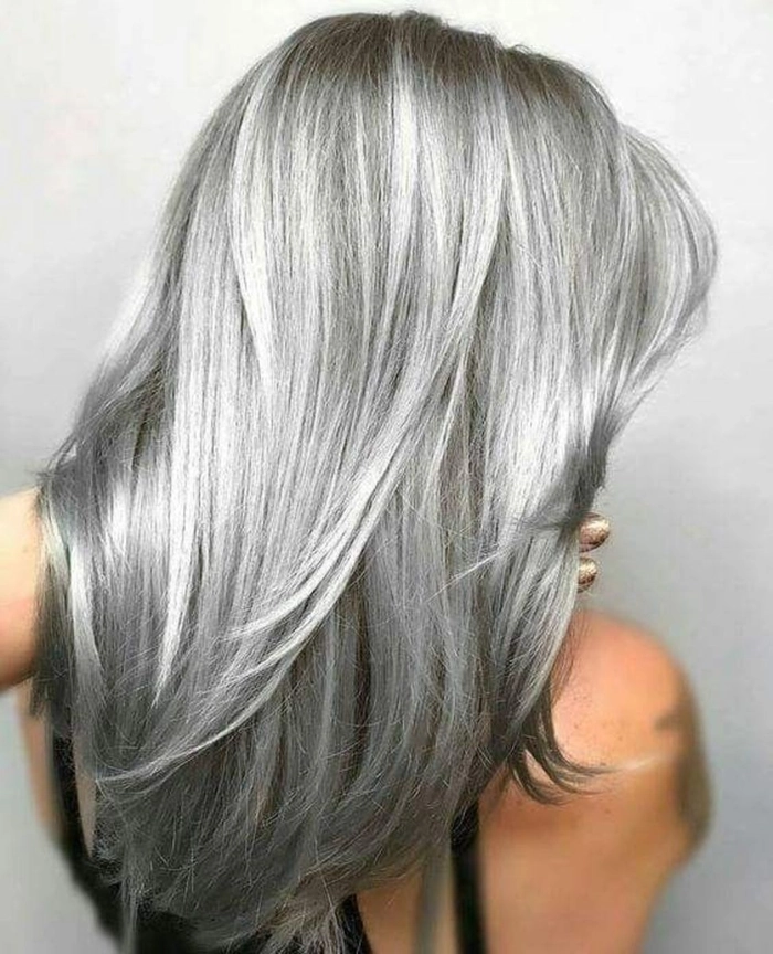 Silver gray beach wave hairstyle flowing in ocean breeze