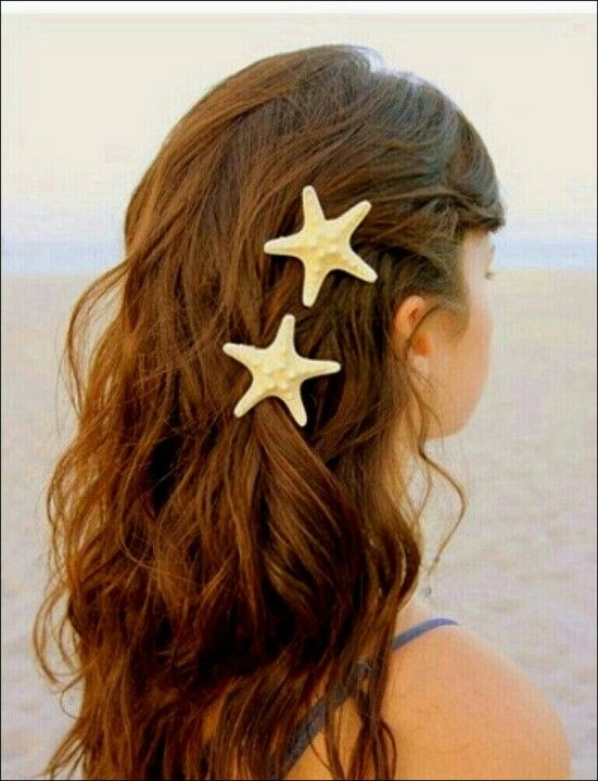 Beach hairstyle inspiration using starfish hair clips for a tropical vibe Starfish hair clips securing a relaxed beach hairstyle with soft waves