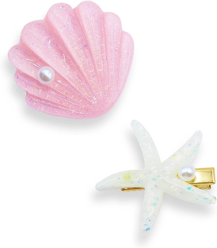 Starfish hair clips for a playful and breezy tropical beach look Starfish hair clips accenting a loose beach wave hairstyle with ocean highlights