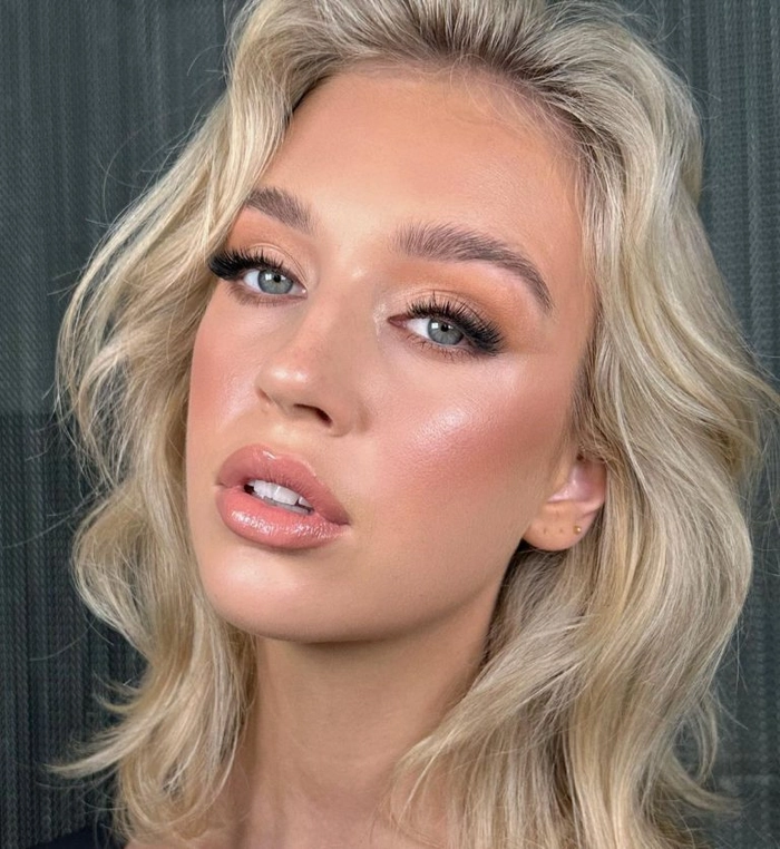 Sun kissed highlights beach look hairstyle with loose waves and golden tones