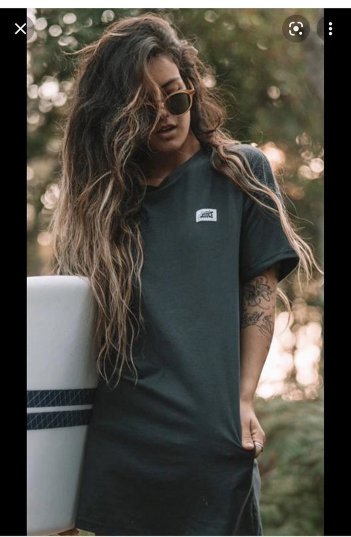 Sun-bleached wavy surfer girl hair with beachy texture and natural highlights