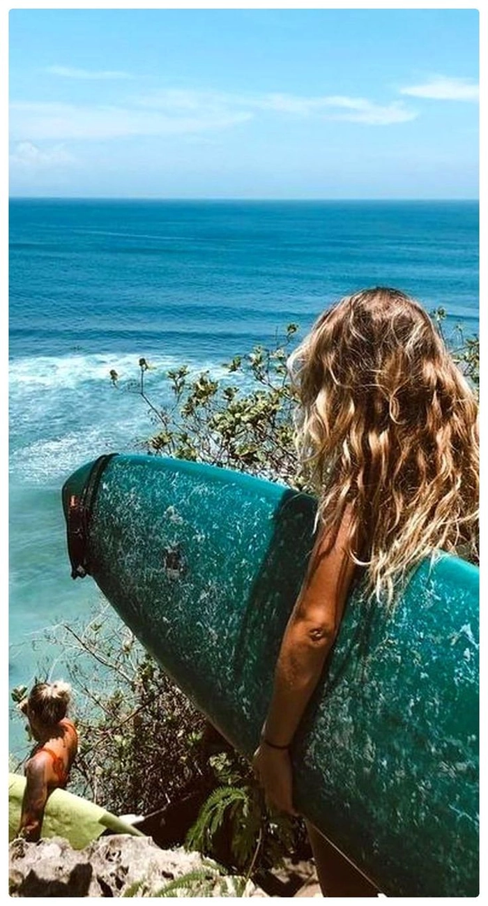 Woman with tousled surfer waves and sun-lightened beach hair