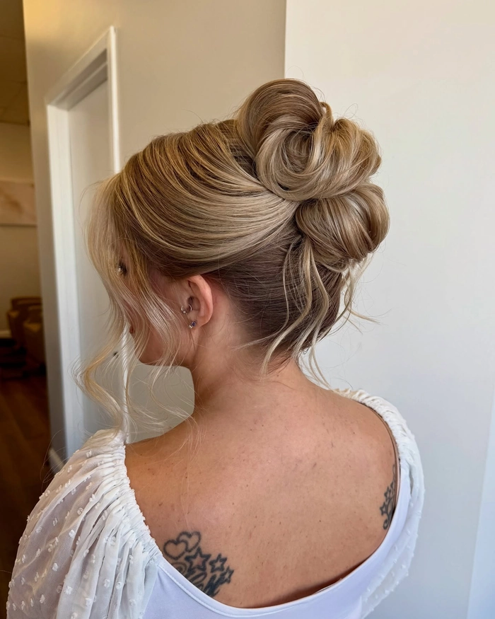 Effortless thick hair beach updo with a braided crown and salt-sprayed waves