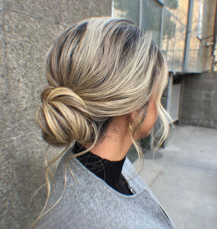 A thick hair beach updo with soft waves and braided accents