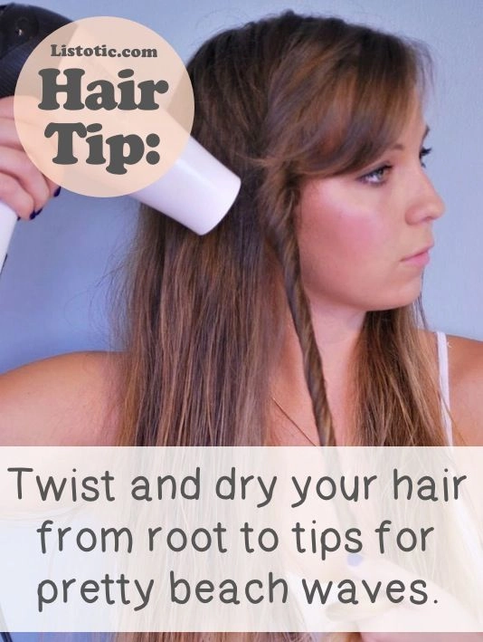 Woman with thin hair styling beachy waves using a volumizing salt spray trick for added texture