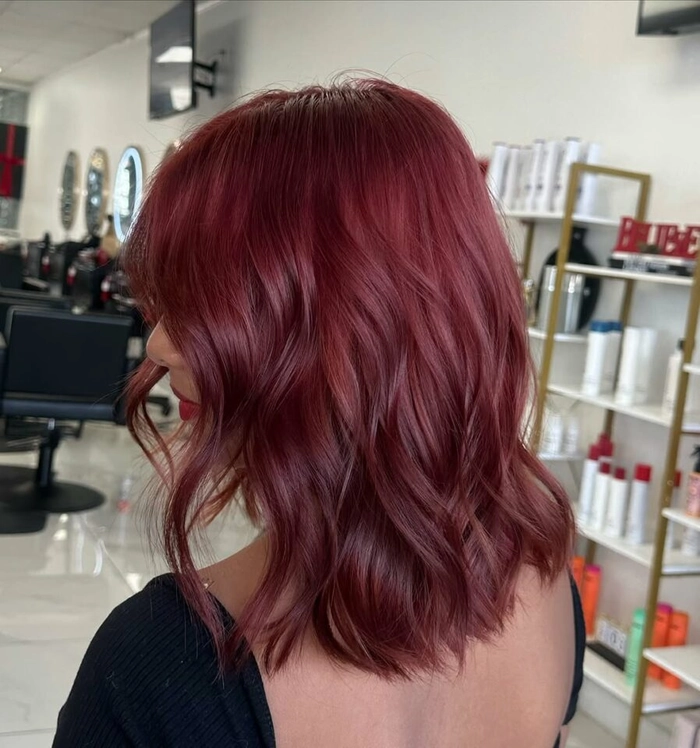 Woman with thin hair using beach texture trick for volume