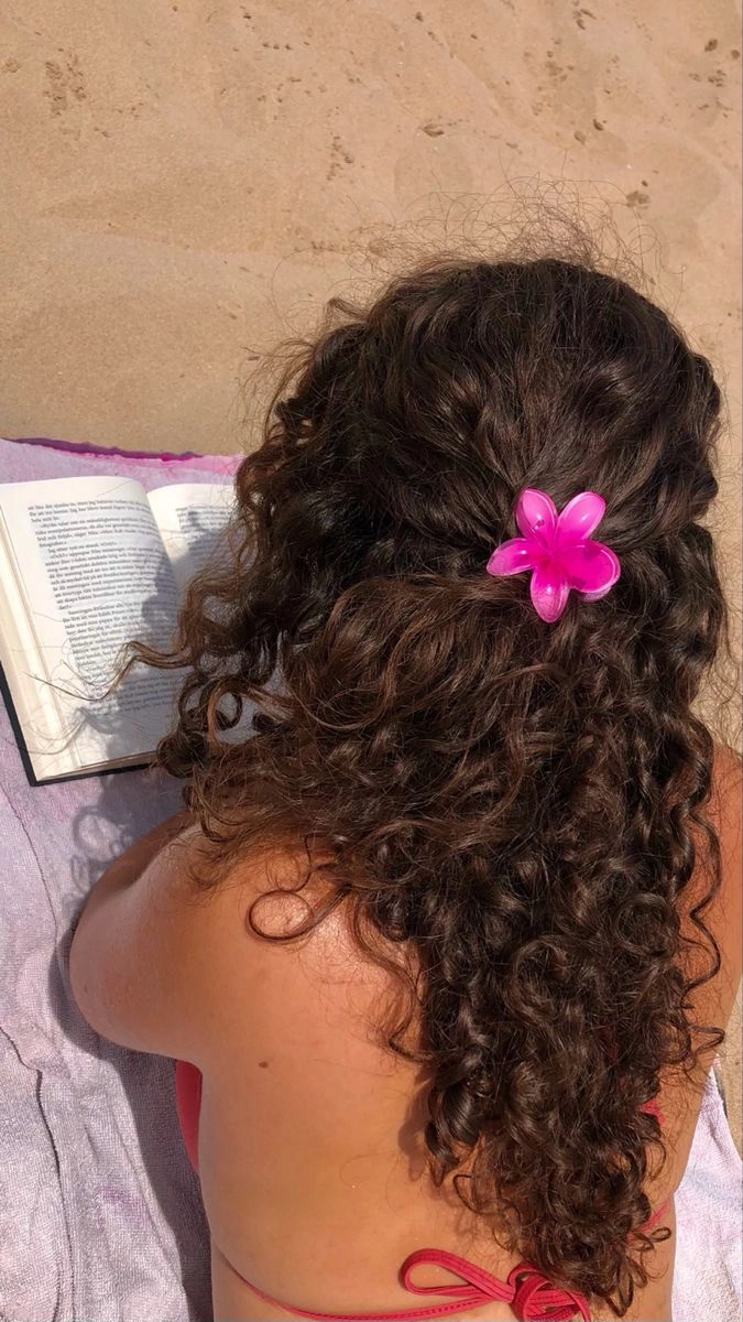 Easy toddler beach hair ideas for a fun day by the ocean Toddler with cute braided beach hairstyle smiling in the sun