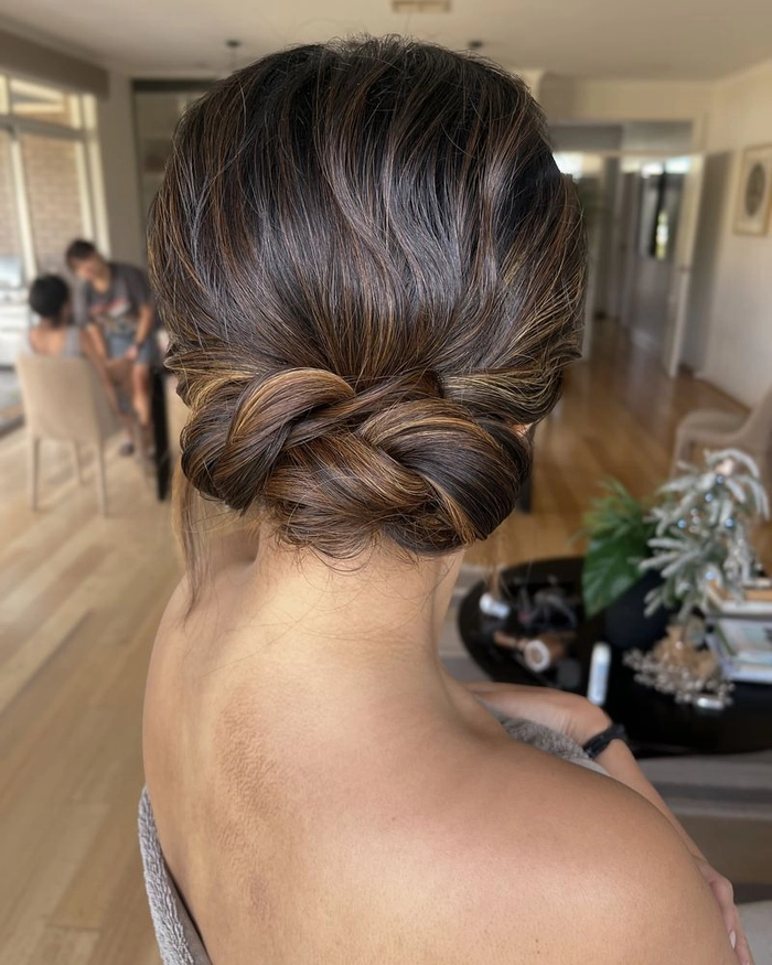 Elegant twisted updo for a day at the beach Twisted beach updo with loose waves and beachy texture