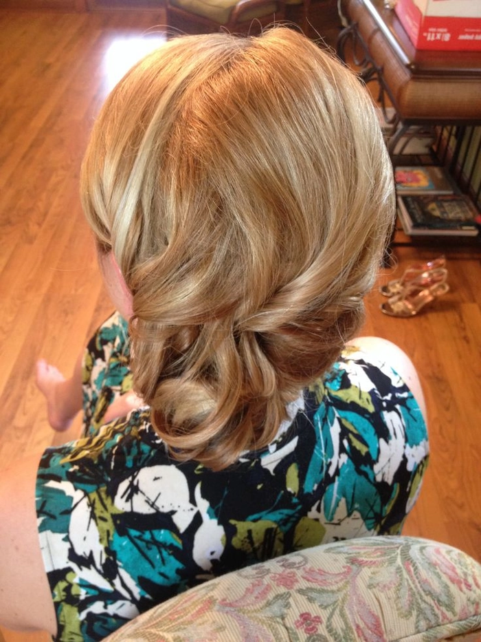 Twisted updo styling ideas for a casual beach look Twisted beach updo with textured waves and a center twist