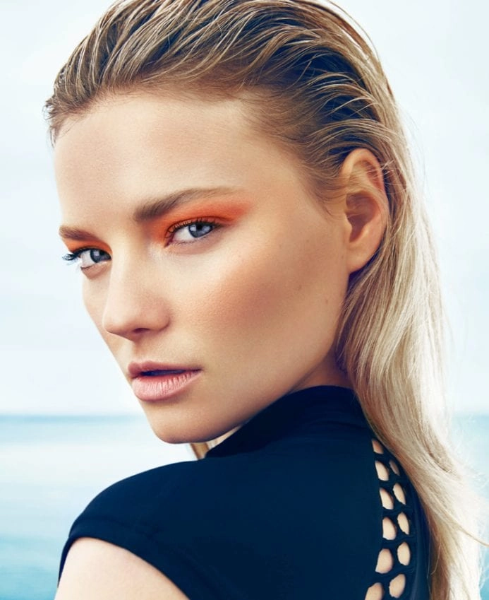 Model with sleek wet look beach hair and natural waves