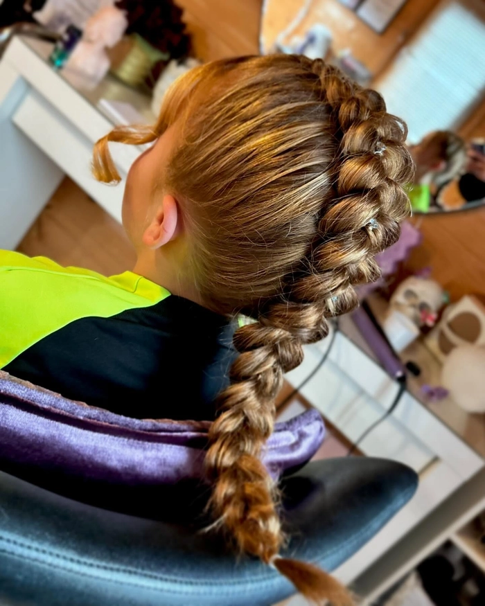 Casual quick Dutch braid hairstyle perfect for active teenagers Active teen girl with a quick Dutch braid hairstyle for a casual look