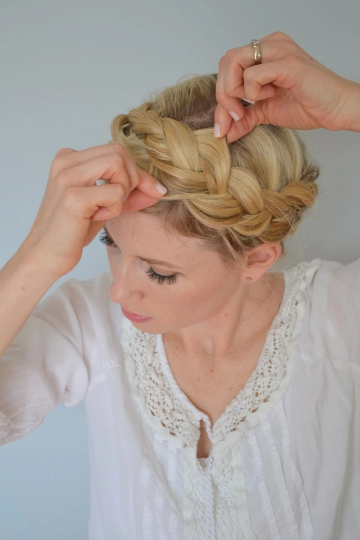 Bohemian casual hairstyle featuring a simple crown braid with loose waves