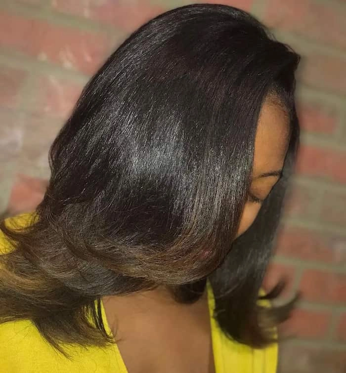 Relaxed bouncy blowout on medium hair styled for a casual weekend look