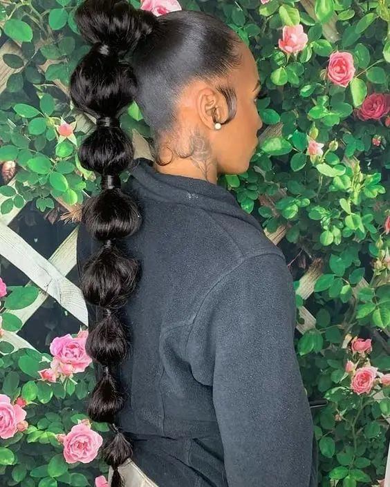 casual bubble braid ponytail hairstyle on long hair for everyday looks