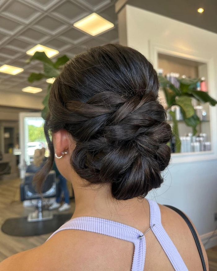 Casual braided low bun hairstyle suitable for both office and evening occasions