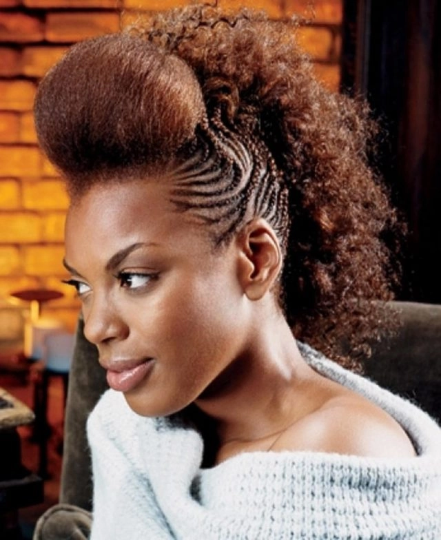 Casual braided mohawk hairstyle for an everyday edgy streetwear vibe A woman with a casual braided mohawk hairstyle paired with edgy streetwear and accessories