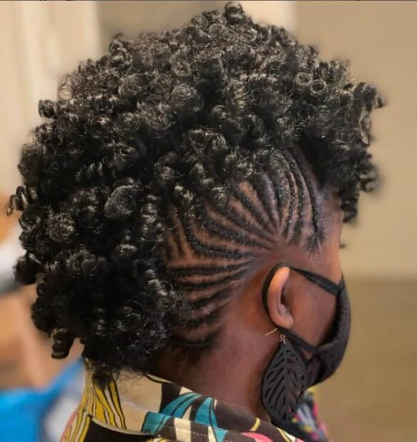 Casual braided mohawk hairstyle that adds an edgy touch to any everyday streetwear outfit A woman with a casual braided mohawk paired with edgy streetwear accessories for everyday style