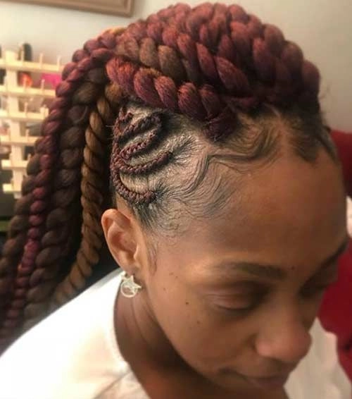 Edgy everyday streetwear look with braided mohawk Woman with casual braided mohawk hairstyle in edgy streetwear outfit