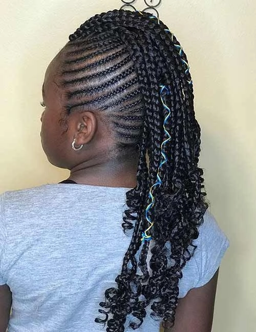 Casual Braided Mohawk Style for Edgy Streetwear A woman with a casual braided mohawk hairstyle, wearing edgy streetwear for a bold everyday look
