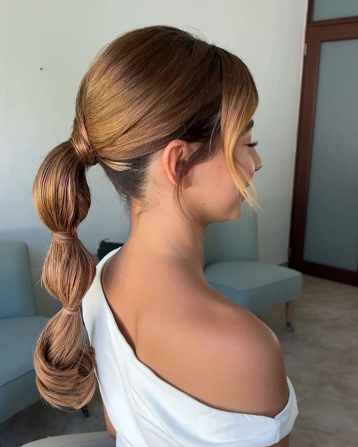 casual bubble braid ponytail on long hair with relaxed, effortless style