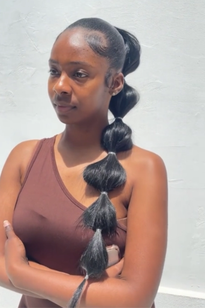 Casual bubble braid ponytail hairstyle for long hair with effortless charm