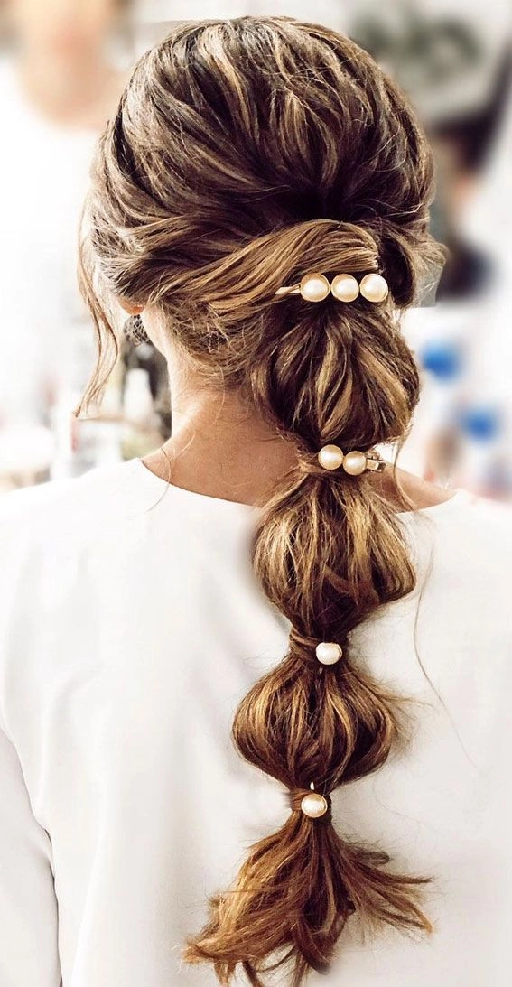 casual bubble braid ponytail hairstyle on long hair for everyday wear
