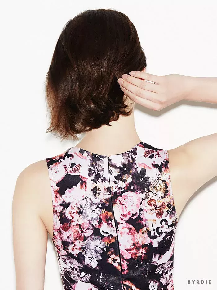 Casual French twist hairstyle on short hair featuring elegant loose strands