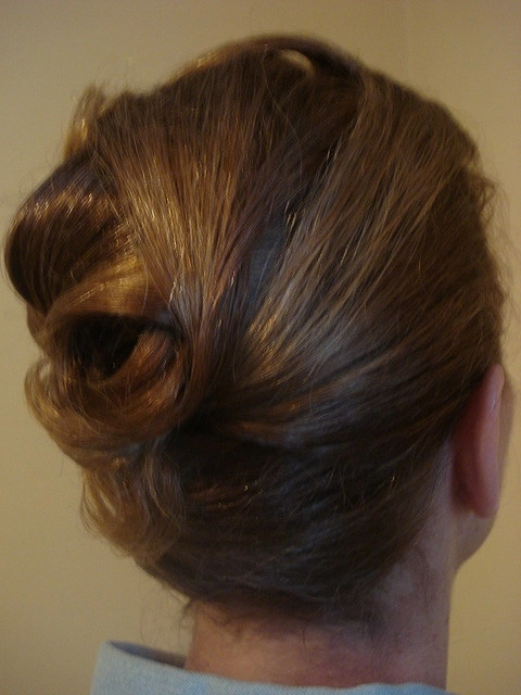 Casual French twist hairstyle on short hair with loose strands for a relaxed look
