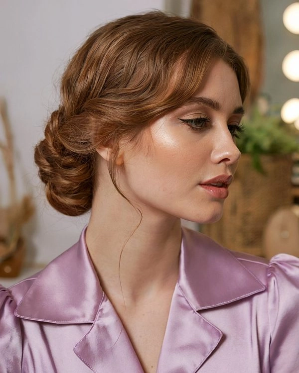 Casual French twist hairstyle on short hair with loose strands for a relaxed look