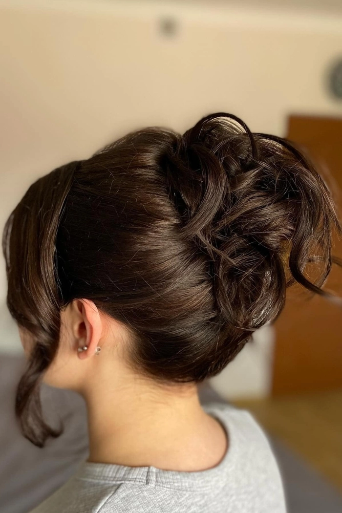 Casual French twist hairstyle on short hair with loose tendrils framing the face