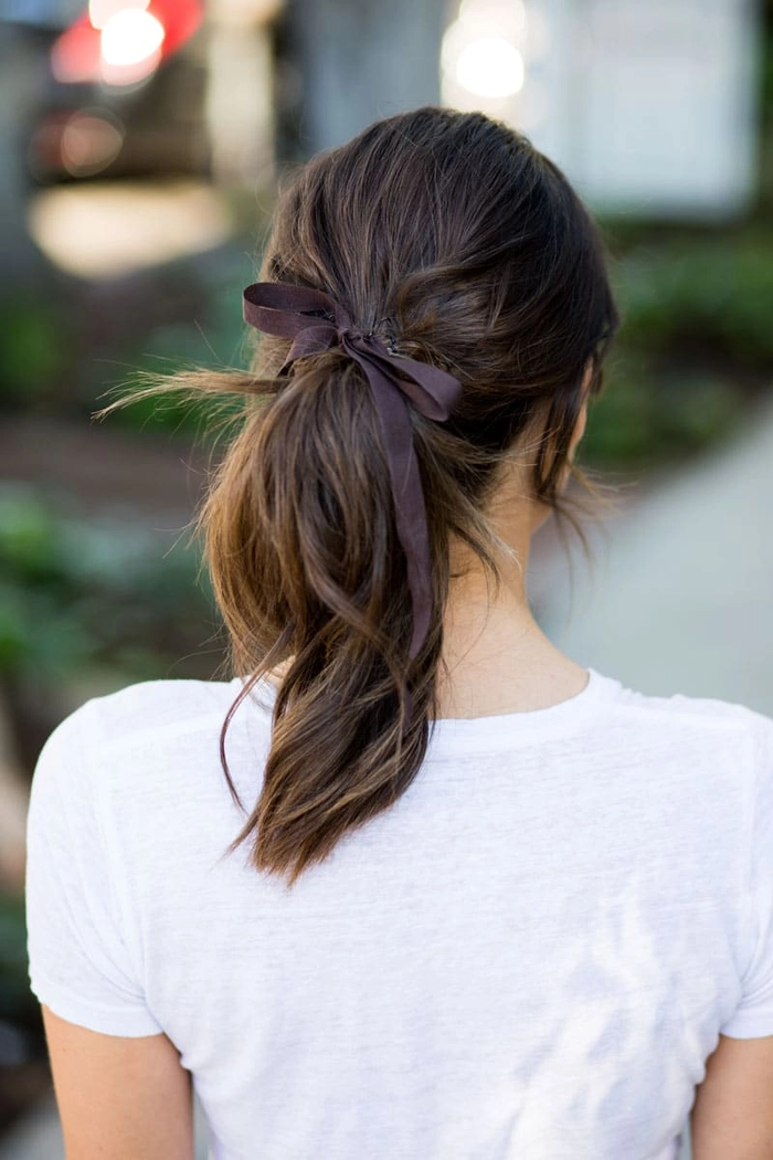 Quick ribbon ponytail style for a casual coquette look with a soft bow
