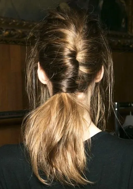 A relaxed weekend look featuring a casual side ponytail with soft waves.