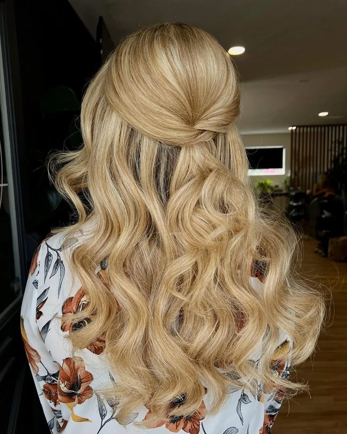 Casual twisted half up hairstyle perfect for thin hair with soft waves