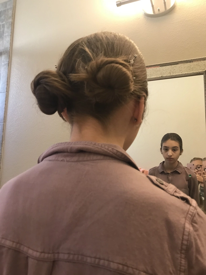 Casual twisted pigtail buns for a playful weekend look
