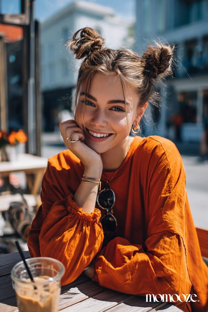Playful twisted pigtail buns for a casual weekend look
