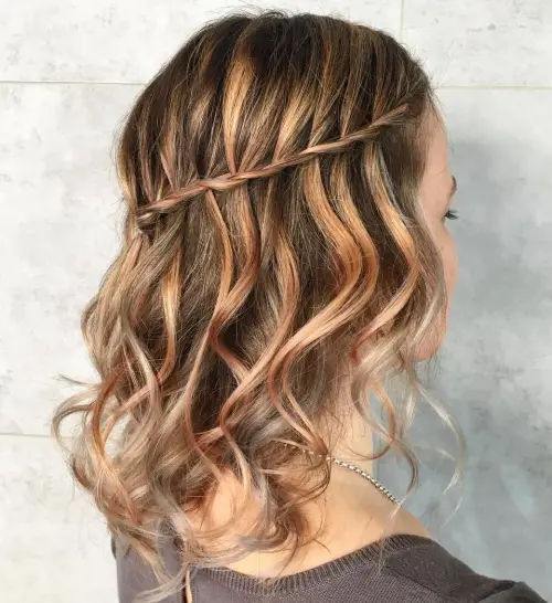 Elegant casual waterfall braid style for romantic evening looks Woman showcasing a casual waterfall braid hairstyle perfect for date nights