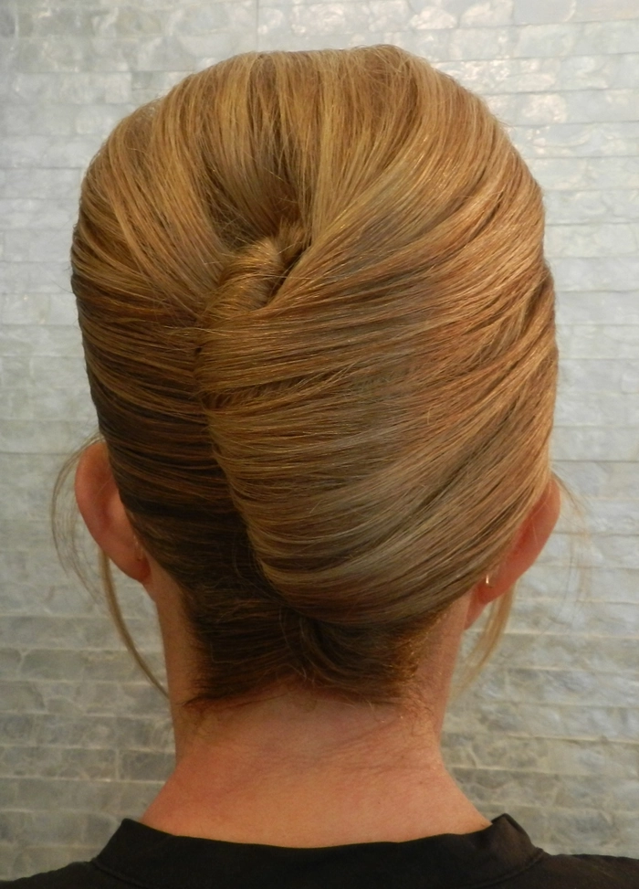Effortless elegance achieved with simple French barrette updos in casual hairstyles Casual woman wearing a simple French barrette updo hairstyle for effortless elegance